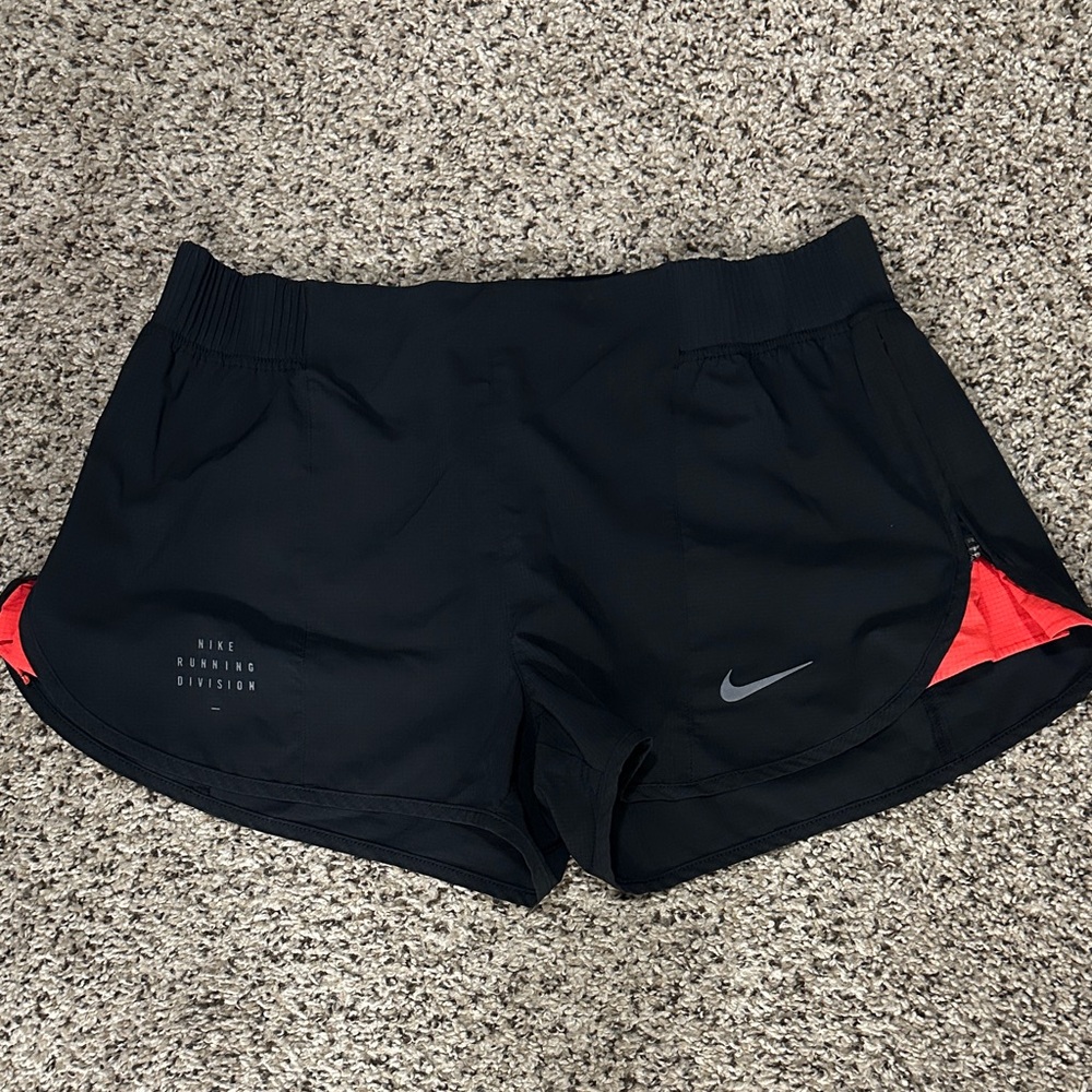 Nike Women's Black and Red Athletic Shorts with adjustable side zipper